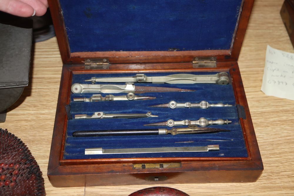 A quantity of mixed collectables including a planished pewter box, a draughtsman set, a large padlock and key, daggers etc